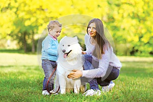 Family, leisure and people concept - mother and child walking wi