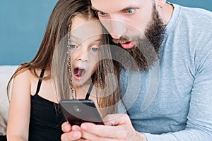 Family leisure shock amazed dad kid reaction phone