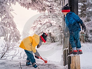 Family with little boy and girl is having fun playing in Zao winter skii resort, Sendai, Japan