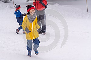 Family with little boy and girl is having fun playing in Zao winter skii resort, Sendai, Japan