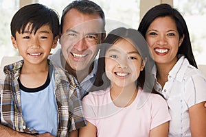 Family in living room smiling