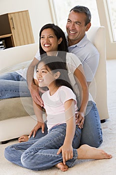 Family in living room smiling