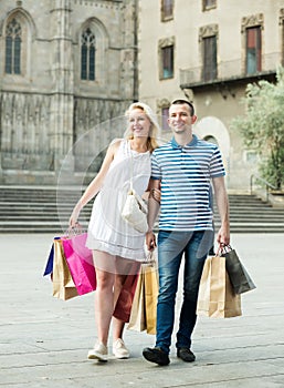 Family looking satisfied after shopping in city