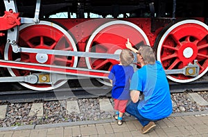 Family looking at steam train