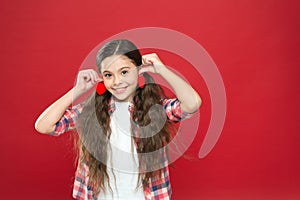 Family love. Girl cute child with hearts. Kid girl with long hair red background. Celebrate valentines day. Playful baby