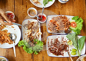 Family lunch food on wooden table with all local food eat with Thai steamed rice