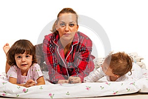 Family lying in bed