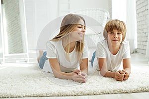 Family lying on the carpet at home