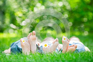 Family lying on grass