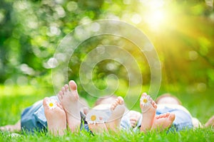 Family lying on grass photo