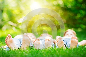 Family lying on grass