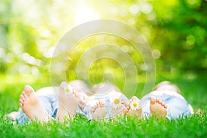 Family lying on grass