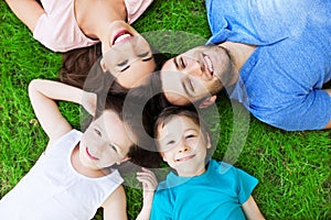 Family lying on grass