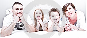 Family lying on mattresses