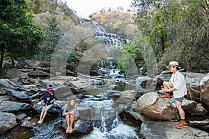 The family at Mae Ya Waterwall, Inthanon National Park, Chiangmai, Thailand