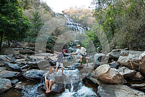 The family at Mae Ya Waterwall, Inthanon National Park, Chiangmai, Thailand