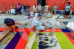 Family make Good Friday carpet, Antigua, Guatemala