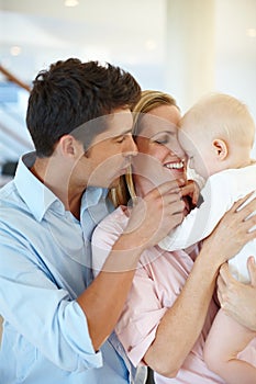 Family makes this house a home. a happy family looking contented at home.