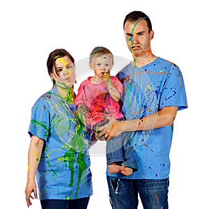Family making faces after having a paint fight
