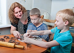 Family making gingerbread cookies