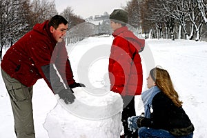 Family Making Snowman