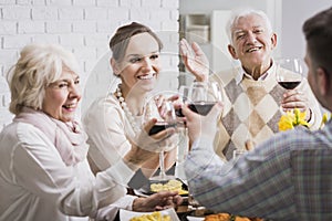 Family making a toast at dinner