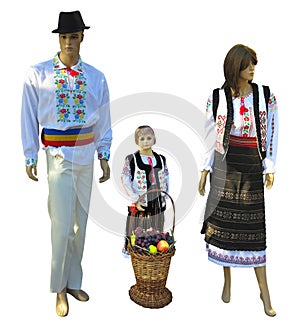 Family Mannequins in national traditional balkanic, moldavian, romanian costumes isolated over white photo