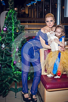 Family, x-mas, winter holidays and people concept - happy mother and little daughter