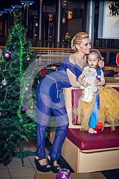 Family, x-mas, winter holidays and people concept - happy mother and little daughter