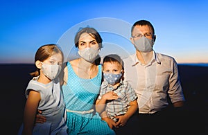Family in masks during pandemia photo