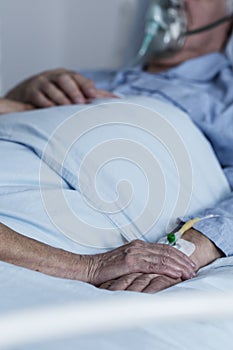 Family member comforting dying patient photo