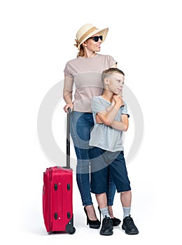Family, mom in sunglasses and hat with a red suitcase and son, isolated on a white background