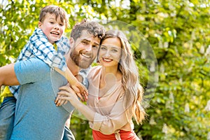 Family of mother, father and son in playful mood