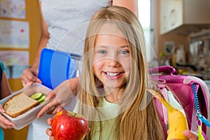 Family - mother making breakfast for school