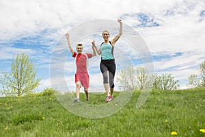 Family, mother and son are running or jogging for sport outdoors