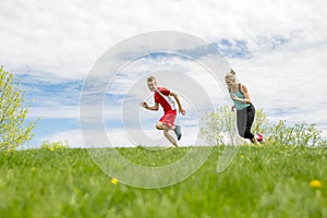 Family, mother and son are running or jogging for sport outdoors