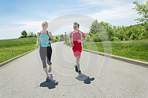 Family, mother and son are running or jogging for sport outdoors