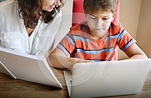 Family Mother Son Using Digital Laptop Concept