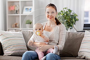 close up of mother with baby drinking water