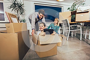 Family moving home with boxes around