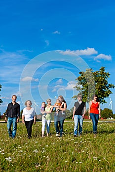 Family and multi-generation - fun on meadow in summer