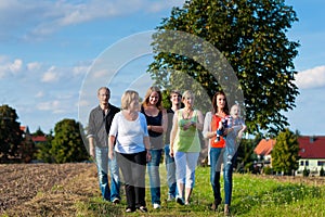 Family and multi-generation - fun on meadow in summer