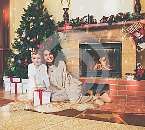 Family near fireplace in decorated house interior