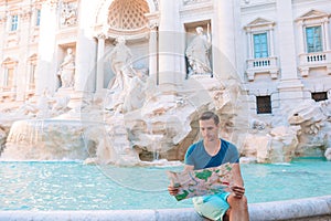 Family near Fontana di Trevi, Rome, Italy. Happy father enjoy italian vacation holiday in Europe.