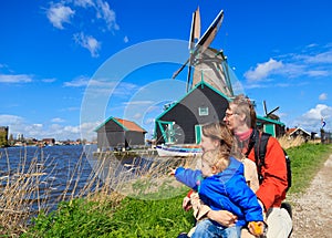 Family near windmill in Holland