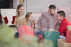 Family opening christmas gifts