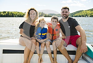 Family out boating together having fun on vacancy