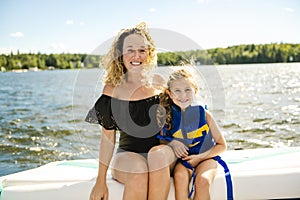 Family out boating together having fun on vacancy