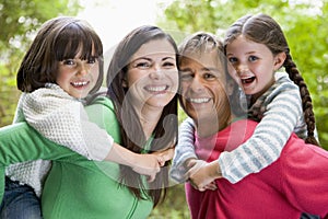 Family outdoors smiling