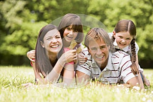 Family outdoors smiling